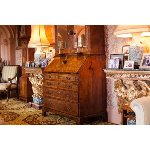 566 - Fine George II feather banded walnut bureau cabinet, the moulded cornice over a pair of glazed mirro... 