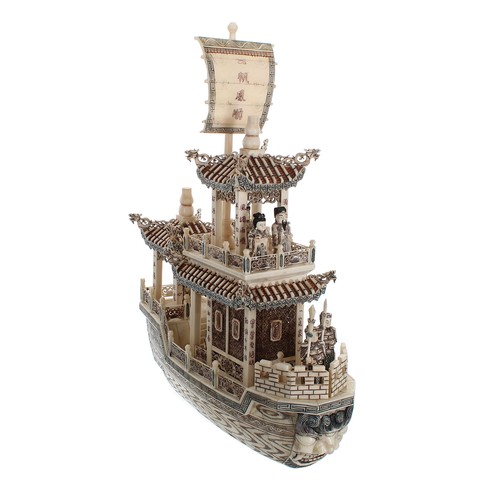 333 - Carved and stained bone model of a Imperial Chinese boat with figures, 19.5