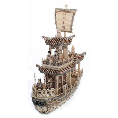 333 - Carved and stained bone model of a Imperial Chinese boat with figures, 19.5