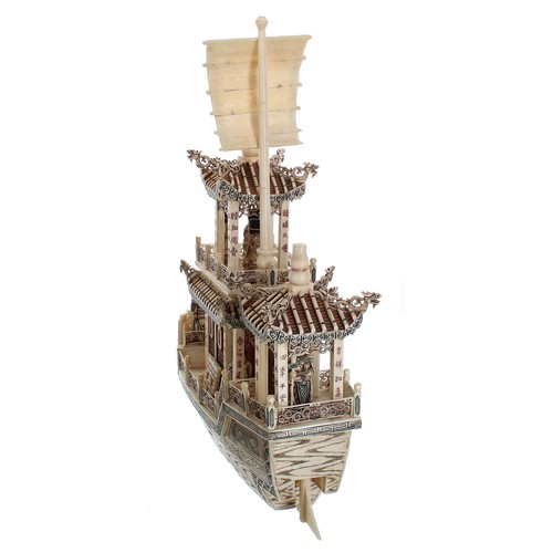 333 - Carved and stained bone model of a Imperial Chinese boat with figures, 19.5