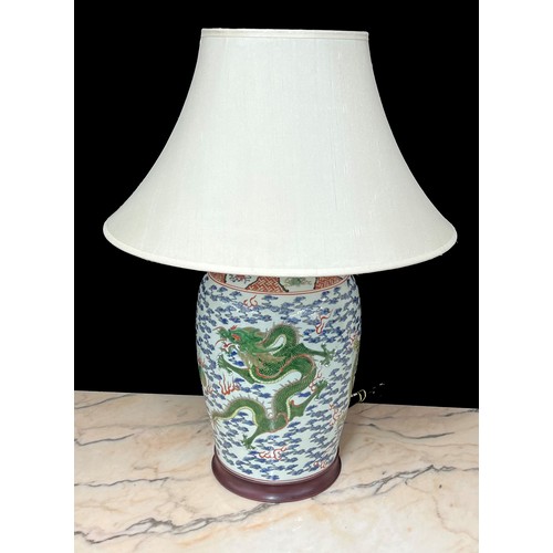 270 - Good pair of large Chinese porcelain vases converted to table lamps, profusely decorated with green ... 