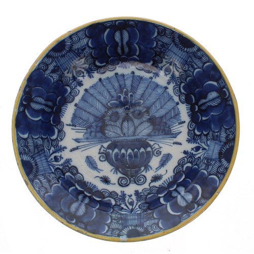 188 - Dutch Delft blue and white pottery circular dish, decorated with a jardinière of flowers within a de... 