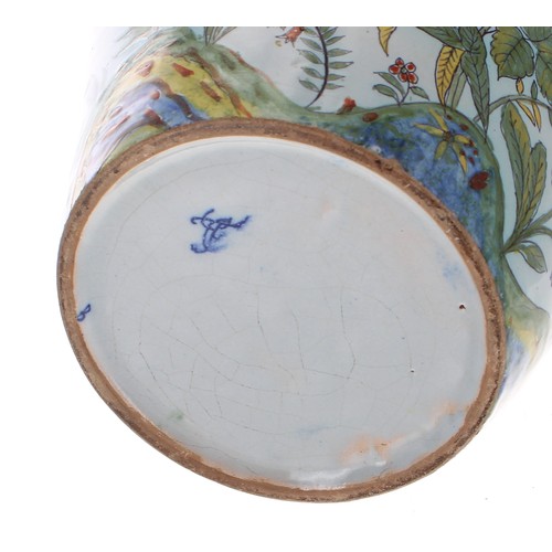 188 - Dutch Delft blue and white pottery circular dish, decorated with a jardinière of flowers within a de... 