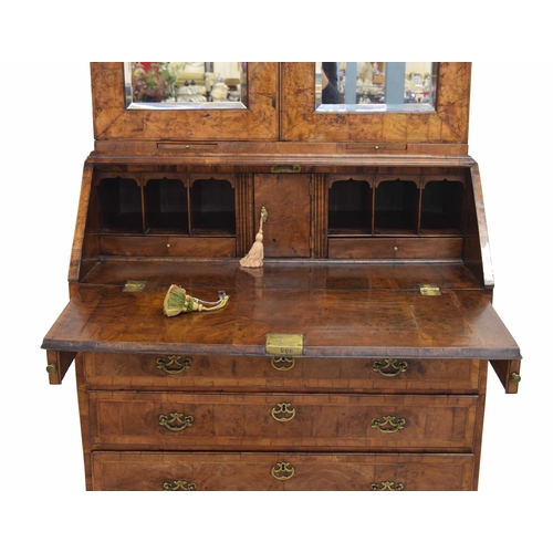 566 - Fine George II feather banded walnut bureau cabinet, the moulded cornice over a pair of glazed mirro... 