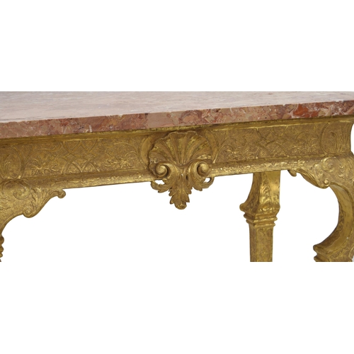 567 - George I giltwood side table in the manner of James Moore, the breche violette marble top over a car... 