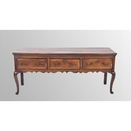 556 - George III oak dresser base, the moulded top over three walnut cross banded drawers with applied bra... 