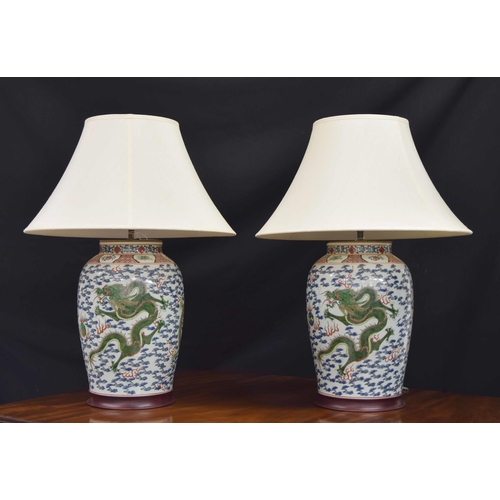 270 - Good pair of large Chinese porcelain vases converted to table lamps, profusely decorated with green ... 