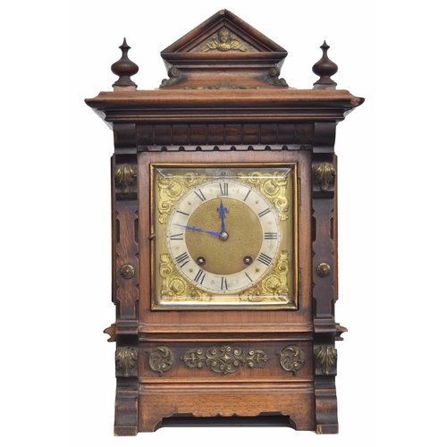 2311 - German walnut two train ting-tang mantel clock, the RSM movement striking on two gongs, within an ar... 