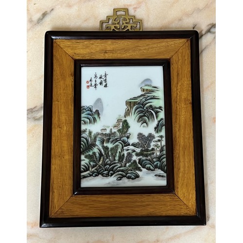 247 - Pair of Chinese porcelain plaques in hardwood frames, each depicting landscapes, 20th century, 11.25... 