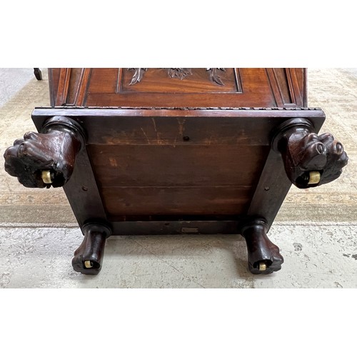 569 - Fine Regency mahogany cellarette, of sarcophagus form with a hinged cover enclosing a metal lined in... 