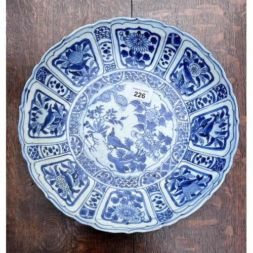 226 - Chinese blue and white porcelain circular dish, in the 'Kraak' style, the centre decorated with bird... 