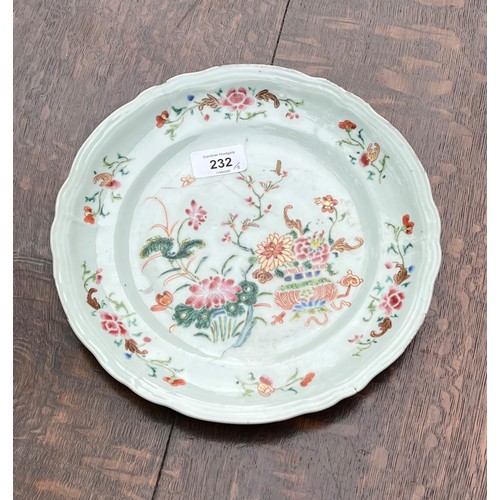 232 - Two Chinese famille rose porcelain plates and a shallow bowl, each decorated with flowers, Qianlong,... 