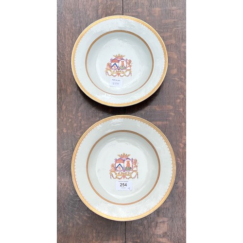 254 - Pair of Chinese export armorial porcelain circular shallow bowls, each painted with coat-of-arms wit... 