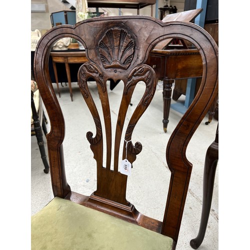 559 - Fine George I walnut side chair, the curved top rail with a central shell motif above a bird head an... 