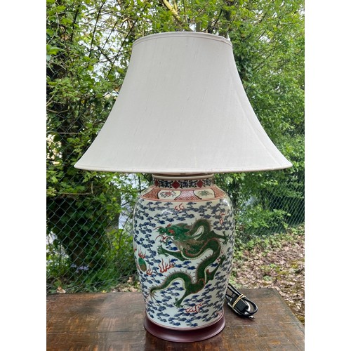 270 - Good pair of large Chinese porcelain vases converted to table lamps, profusely decorated with green ... 