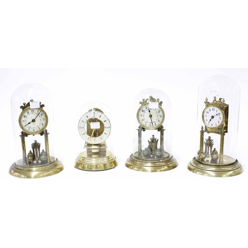 2305 - Three various brass torsion mantel clocks with ball pendulums and under glass domes, all stamped to ... 