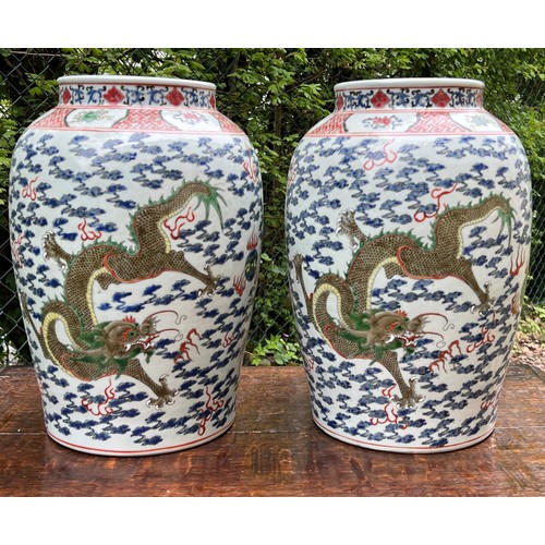 270 - Good pair of large Chinese porcelain vases converted to table lamps, profusely decorated with green ... 