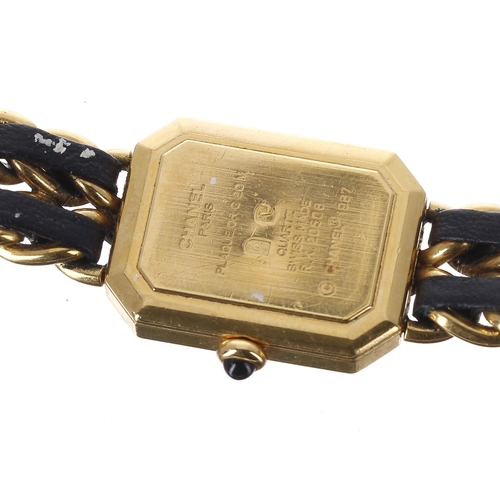 152 - Chanel, Paris rectangular gold plated lady's wristwatch, reference no. R.K. 20508, rectangular black... 