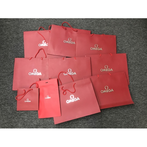 229 - Ten Omega red boutique/retail bags