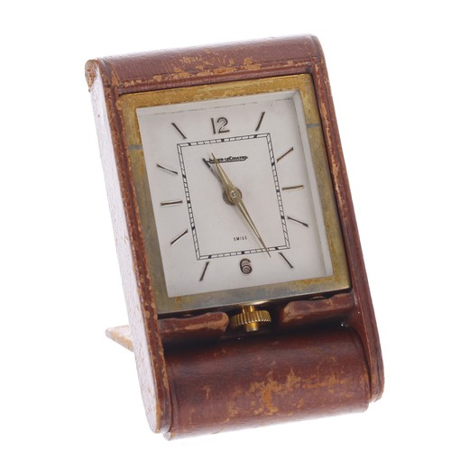 2521 - Jaeger-LeCoultre travel clock, the gilt metal case hinged within a tan leather travel case, case no.... 