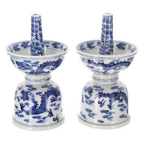 838 - Pair of Chinese export blue and white porcelain candlesticks, of double bowl form decorated with dra... 