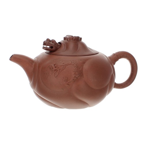 837 - Chinese Yixing red ware teapot and cover, with dragon relief decoration, the cover with an articulat... 