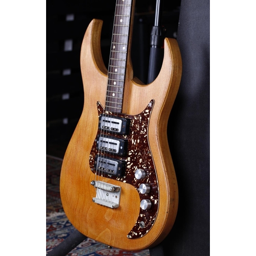 722 - 1960s Egmond solid body electric guitar, made in Holland; Body: natural stripped finish; Neck: maple... 