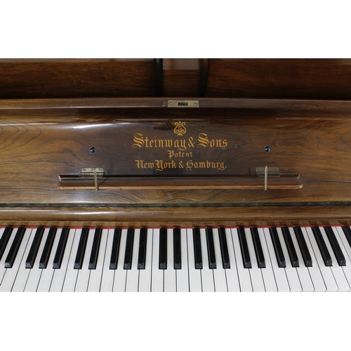 1555 - Good rosewood Steinway & Sons upright piano, the overstrung iron frame stamped with the ser. no.... 