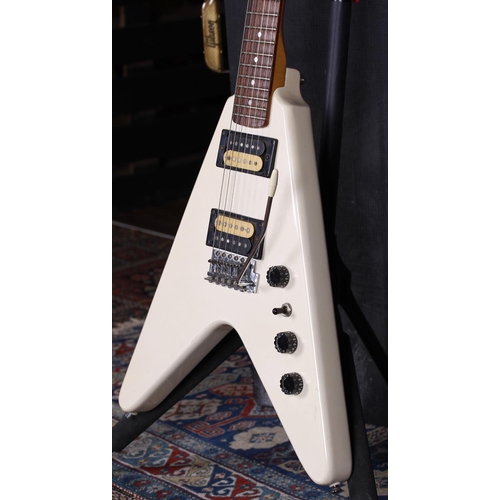 766 - 1986 Epiphone by Gibson V2 Flying V electric guitar; Body: white finish, dings and scratches; Neck: ... 