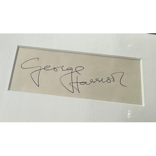 415 - George Harrison - autographed display, mounted below a picture of George Harrison playing an Epiphon... 