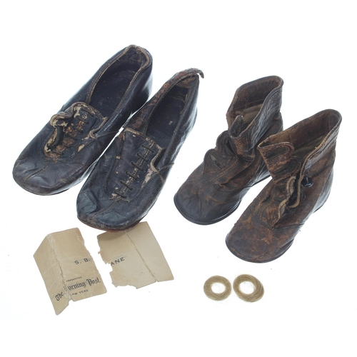 769 - Two pairs of vintage children's leather shoes; togethr with two blonde hair curls and a Ne... 