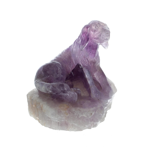 771 - Carved polished amethyst figure of a dog, on a base of rough crystal, 6