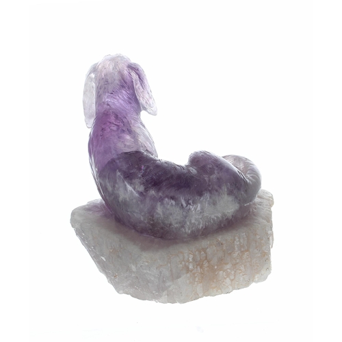 771 - Carved polished amethyst figure of a dog, on a base of rough crystal, 6