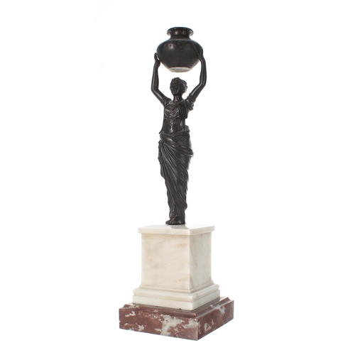 777 - Decorative bronze figure after the antique, modelled as a Grecian maiden holding aloft an urn, mount... 