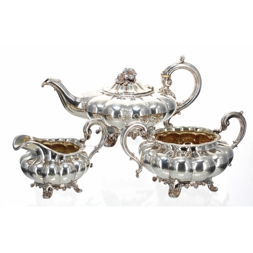William IV three piece silver tea set, each with C scroll capped handles, the teapot with ivory insulators, of lobed melon shape bodies raised on cast scroll feet, maker Joseph Angell I & John Angell I, London 1835 teapot 11" wide, 6" high, 42.6oz t total (3)
