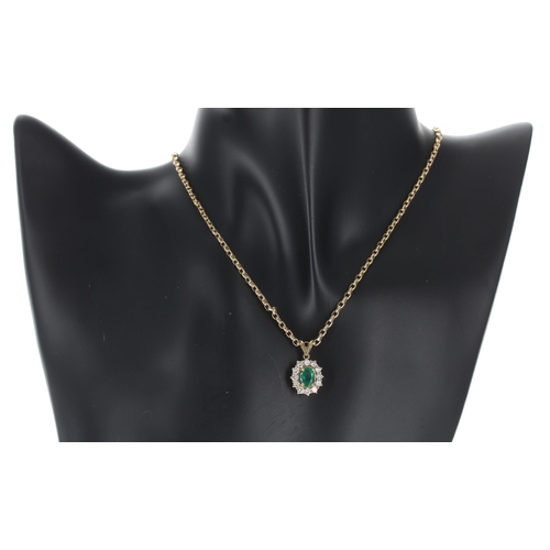 153 - Attractive 18ct yellow gold emerald and diamond oval cluster pendant and necklace, the emerald 0.65c... 