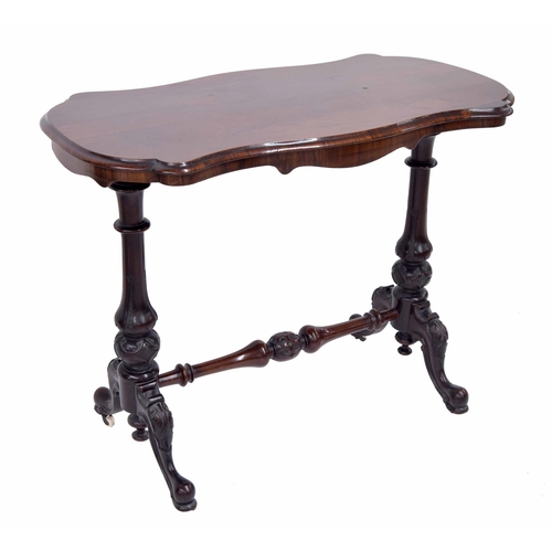 1022 - Victorian rosewood serpentine stretcher side table, the moulded top over a shaped apron, raised on t... 