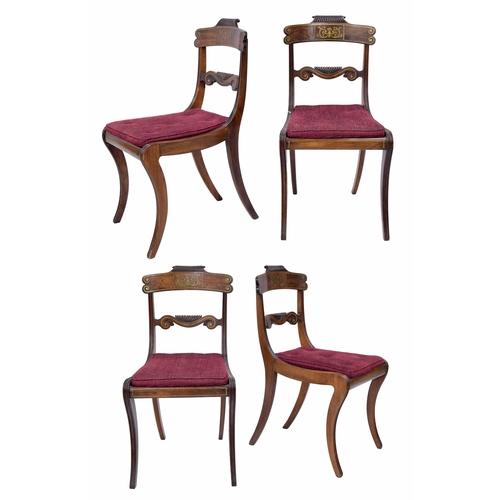 1031 - Set of four Regency rosewood dining chairs, the shaped carved bar backs with brass inlay scroll deco... 