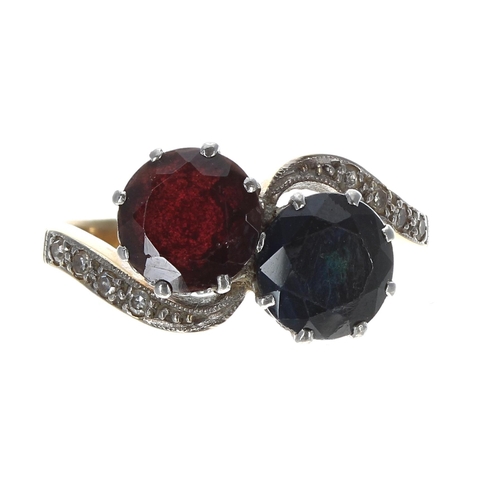 190 - 18ct sapphire and garnet set cross-over design ring with diamond set shoulders, 11mm, 5.7gm, ring si... 