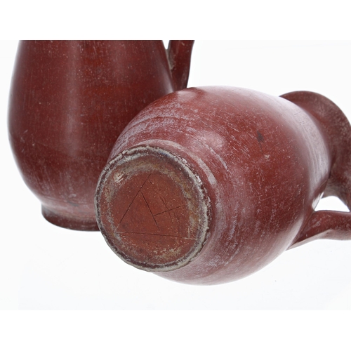 807 - Pair of terracotta pottery jugs, with an artists monogram AT to the undersides, 8.5