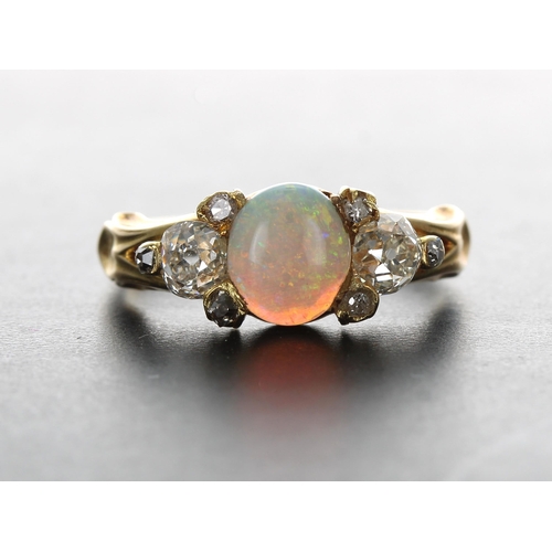 262 - Attractive 18ct cabouchon opal and old-cut diamond claw set ring, the opal 0.55ct approx, width 7mm,... 