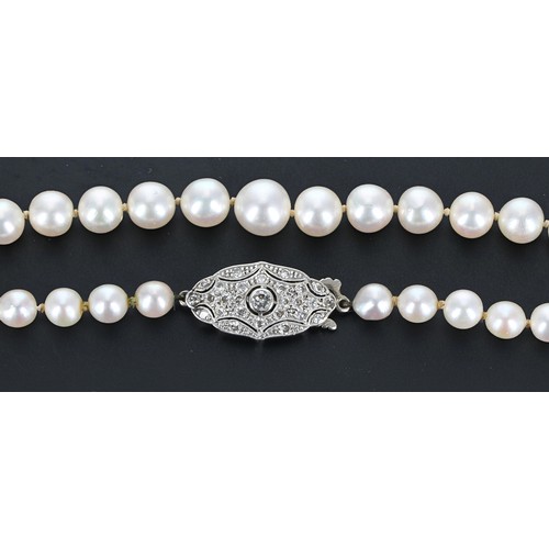 263 - Attractive cultured pearl graduated necklace with an elliptical diamond set clasp, the pearls gradua... 