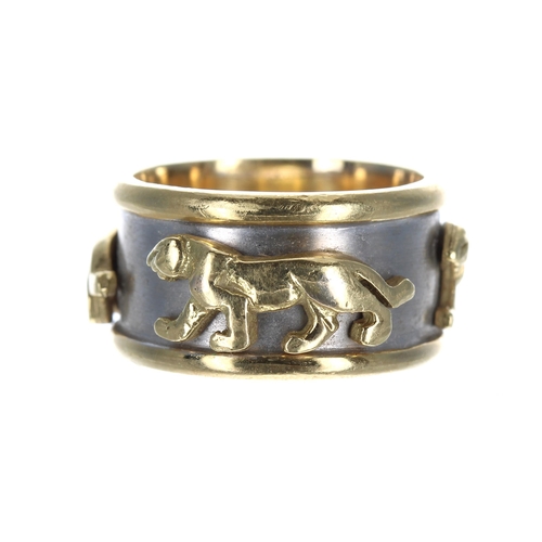 388 - Designer 18ct bicolour band ring, set with three panthers on a white ground, stamped 'AYKA 18', widt... 