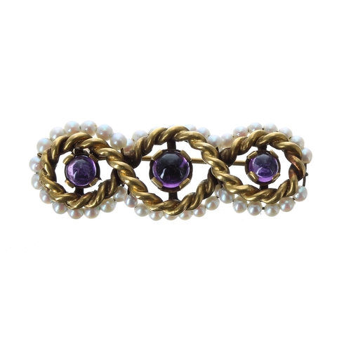 223 - Attractive 14ct rope twist design brooch, with three cabouchon amethyst and a seed pearl border, 7.2... 