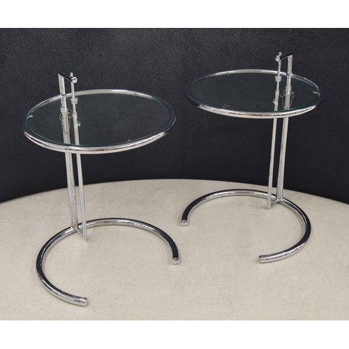 687 - After Eileen Gray (Irish 1878-1976) - pair of model E1027 bedside tables, the circular glass top wit... 