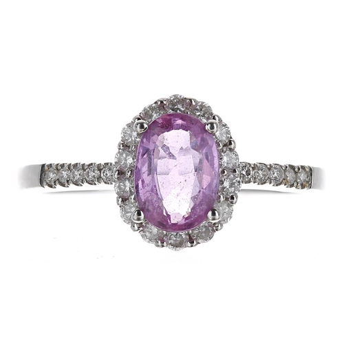 384 - 14ct white gold oval pink sapphire and diamond ring with set shoulders, the sapphire 0.70ct approx, ... 