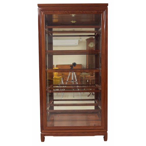 1020 - Modern Chinese hardwood glazed display cabinet, the glazed front panel and side hinged doors enclosi... 