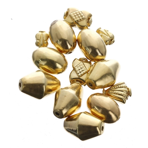 452 - Thirteen yellow metal charms, 8.7gm (Ref. 41)