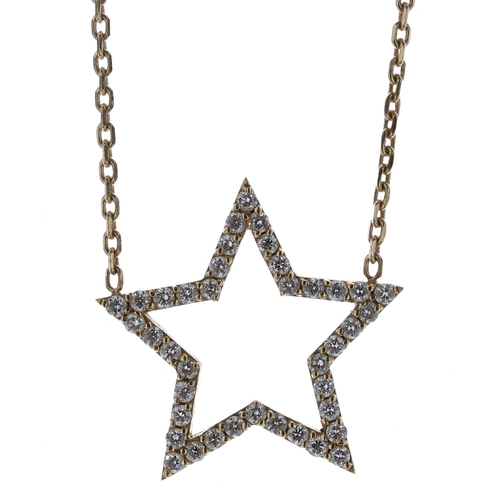 484 - Gold and diamond star necklace marked 750, the pendant 18mm, 3.3gm (Ref. 302)