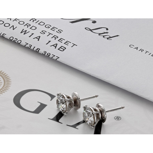 506 - A fine pair of Cartier 18ct white gold  diamond stud earrings with GIA certificates, round brilliant... 